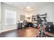 Home office with built-in shelving and exercise bike at 1518 Cloverfield Ct, Wake Forest, NC 27587