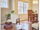 Dining room with hardwood floors, wooden table, and natural light at 1606 Rosetta Dr, Durham, NC 27701