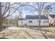 White house exterior with mature trees and landscaping at 1606 Rosetta Dr, Durham, NC 27701