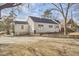 White house exterior with mature trees and landscaping at 1606 Rosetta Dr, Durham, NC 27701