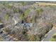 Brick home nestled in wooded lot with large backyard and driveway at 1800 Deer Fern Dr, Raleigh, NC 27606