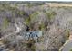 Brick home nestled in wooded lot with large backyard and driveway at 1800 Deer Fern Dr, Raleigh, NC 27606