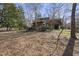 Large backyard with a pergola and mature trees at 1800 Deer Fern Dr, Raleigh, NC 27606