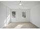 Spacious bedroom with two windows and ceiling fan at 1800 Deer Fern Dr, Raleigh, NC 27606