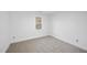 Bright bedroom with neutral carpet and large window at 1800 Deer Fern Dr, Raleigh, NC 27606