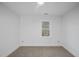 Spacious bedroom featuring a ceiling fan and window at 1800 Deer Fern Dr, Raleigh, NC 27606