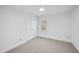 Well-lit bedroom with double doors and ceiling fan at 1800 Deer Fern Dr, Raleigh, NC 27606