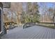Large deck overlooking wooded backyard with benches at 1800 Deer Fern Dr, Raleigh, NC 27606