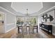 Elegant dining room with chandelier and hardwood floors at 1800 Deer Fern Dr, Raleigh, NC 27606