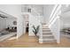 Bright entryway with hardwood floors and staircase at 1800 Deer Fern Dr, Raleigh, NC 27606