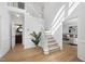 Bright entryway with hardwood floors and staircase at 1800 Deer Fern Dr, Raleigh, NC 27606