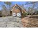 Two-car garage with a basketball hoop and brick walkway at 1800 Deer Fern Dr, Raleigh, NC 27606