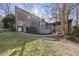 Brick house with a large deck and pergola in the backyard at 1800 Deer Fern Dr, Raleigh, NC 27606