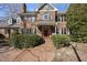 Two-story brick home with red front door and landscaping at 1800 Deer Fern Dr, Raleigh, NC 27606