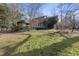 Brick house with a large backyard and mature trees at 1800 Deer Fern Dr, Raleigh, NC 27606