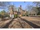 Brick house with two-car garage and side yard at 1800 Deer Fern Dr, Raleigh, NC 27606