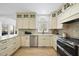 Modern kitchen with granite countertops, stainless steel appliances, and ample cabinetry at 1800 Deer Fern Dr, Raleigh, NC 27606