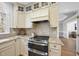 Kitchen features granite countertops, stainless steel appliances, and custom cabinetry at 1800 Deer Fern Dr, Raleigh, NC 27606