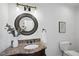 Powder room with granite vanity and decorative mirror at 1800 Deer Fern Dr, Raleigh, NC 27606