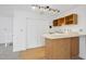 Wet bar with wood cabinets and a small sink at 1800 Deer Fern Dr, Raleigh, NC 27606