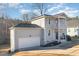 Two-story house with gray siding, a balcony, and an attached garage at 187 Ashley Woods Ct, Clayton, NC 27527