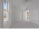 Spacious bedroom with an open closet and large windows at 1917 Faucette Ave, Durham, NC 27704