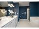 Bathroom boasts double sinks, a tub and shower at 200 S Dawson St # 209, Raleigh, NC 27601