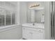 Bathroom with single vanity, mirror, and a shower at 2008 Joelene Dr, Rocky Mount, NC 27803