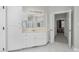 The bright bathroom offers a walk-in shower, large mirror, and ample cabinet storage at 2008 Joelene Dr, Rocky Mount, NC 27803