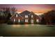 Brick house with landscaped lawn at sunset at 2008 Joelene Dr, Rocky Mount, NC 27803