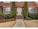 Elegant front entry with brick walkway and landscaping at 2008 Joelene Dr, Rocky Mount, NC 27803