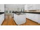 Modern kitchen with white cabinets, granite countertops, and island at 2008 Joelene Dr, Rocky Mount, NC 27803