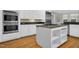 Updated kitchen with stainless steel appliances and island at 2008 Joelene Dr, Rocky Mount, NC 27803