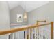 Upstairs landing with lofted area and chandelier at 2008 Joelene Dr, Rocky Mount, NC 27803