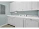 Laundry room with white cabinets and washer/dryer at 2008 Joelene Dr, Rocky Mount, NC 27803