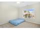 Spacious bedroom with window and neutral decor at 219 Broadgait Brae Rd, Cary, NC 27519