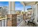 Relaxing deck with brick columns and neighborhood view at 219 Broadgait Brae Rd, Cary, NC 27519