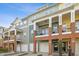 Charming townhome with brick accents, private balconies, and attached garages in a residential neighborhood at 219 Broadgait Brae Rd, Cary, NC 27519