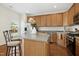 Modern kitchen with stainless steel appliances and island at 219 Broadgait Brae Rd, Cary, NC 27519