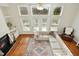 Living Room with fireplace, large windows, and sectional sofa at 219 Broadgait Brae Rd, Cary, NC 27519