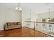 Bright loft area with hardwood floors and a comfortable couch at 219 Broadgait Brae Rd, Cary, NC 27519
