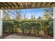 Private patio area with a view of a manicured hedge at 219 Broadgait Brae Rd, Cary, NC 27519