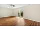 Well-lit room with hardwood floors, sliding door to the patio at 219 Broadgait Brae Rd, Cary, NC 27519