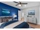 Bedroom with a dresser and blue accent wall at 2305 Ashe St, Durham, NC 27703