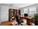 Home office with built-in shelving and hardwood floors at 2305 Ashe St, Durham, NC 27703