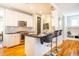 Modern kitchen with white cabinets, stainless steel appliances and breakfast bar at 2494 Briar Chapel Pkwy, Chapel Hill, NC 27516