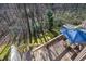 Deck overlooking wooded area with patio furniture at 250 S Estes Dr # 53, Chapel Hill, NC 27514