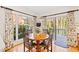 Bright breakfast nook with wood table and views of the backyard at 2716 Townedge Ct, Raleigh, NC 27612