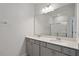 Bathroom featuring double sinks, a large mirror, and granite countertops at 284 Chesapeake Commons St # 150, Garner, NC 27529