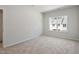 Bedroom featuring natural light from a window overlooking neighboring homes at 284 Chesapeake Commons St # 150, Garner, NC 27529